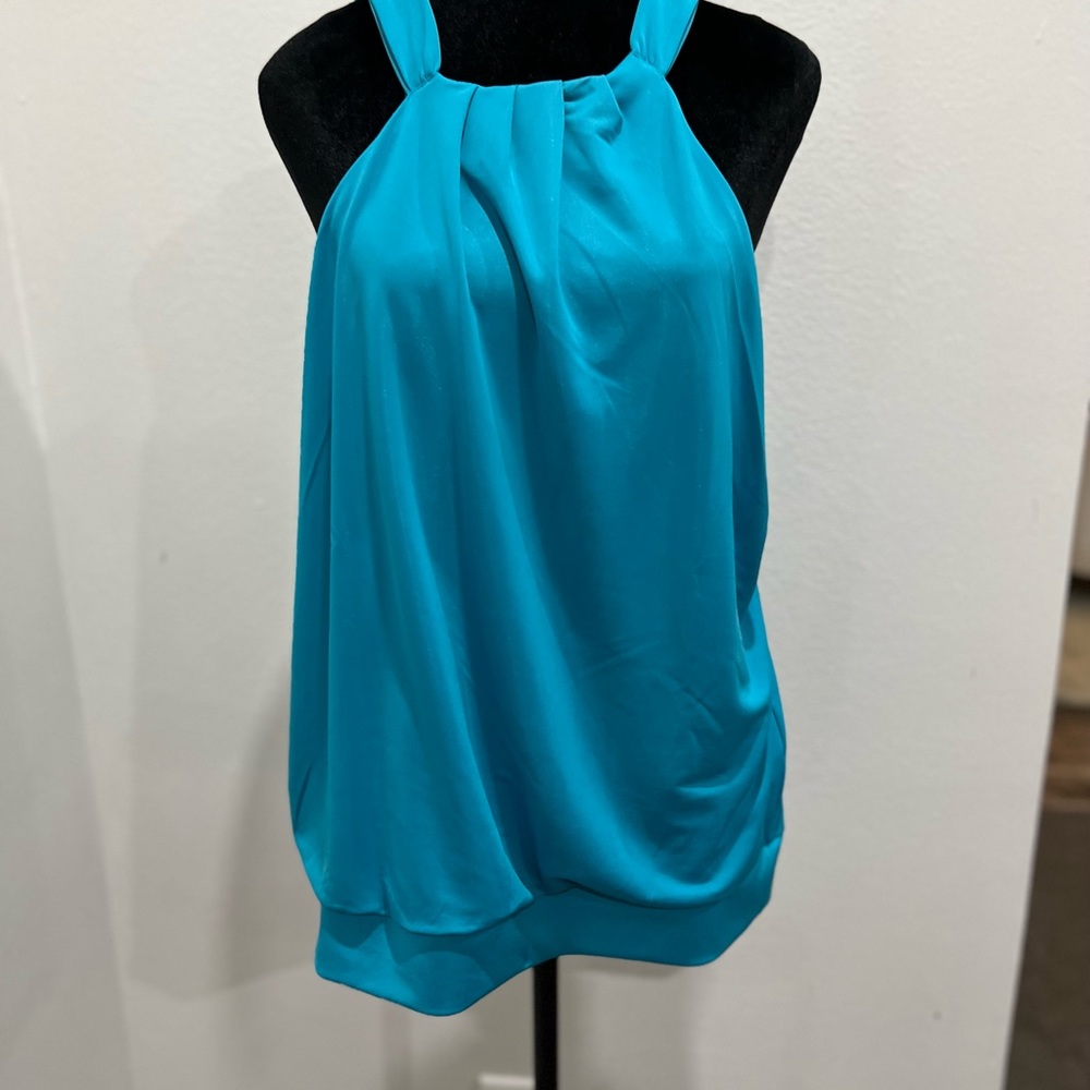 Like new INc.  Cute top to wear as a shell under a jacket or all by itself!